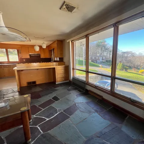 a kitchen with stainless steel appliances a refrigerator and a stove