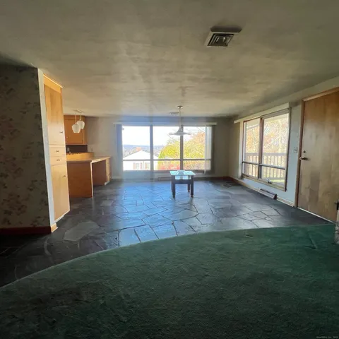 a kitchen with stainless steel appliances a refrigerator and a stove