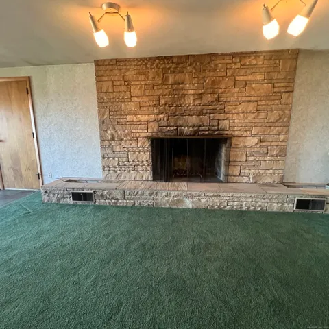 a large white kitchen with a large window