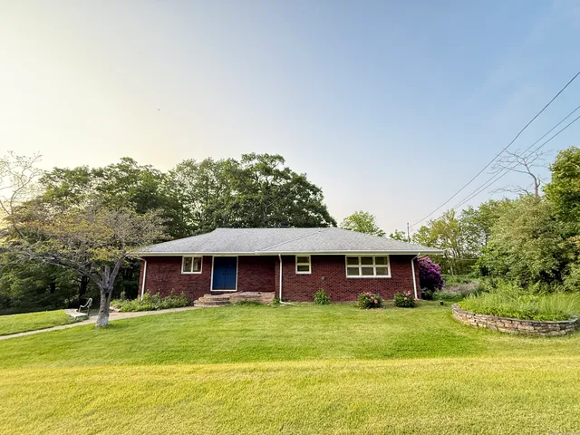 a view of a house with a yard