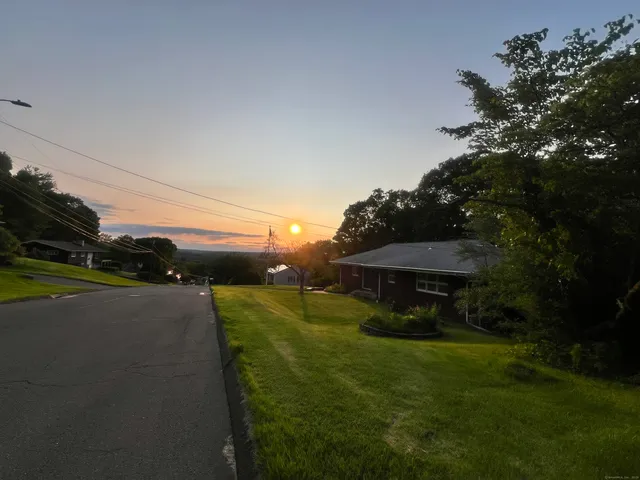 a view of a table and chairs under an umbrella