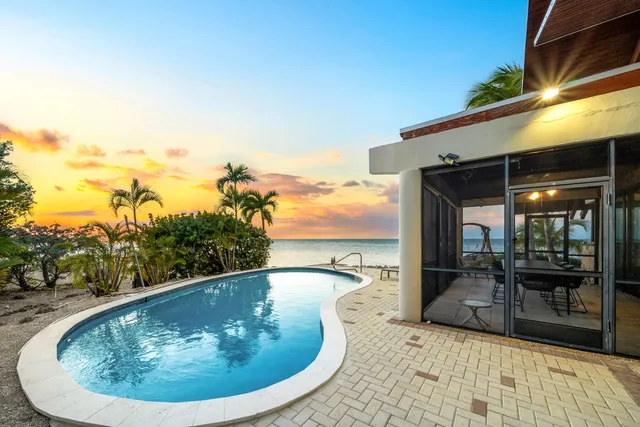 a living room with couches and a flat screen tv