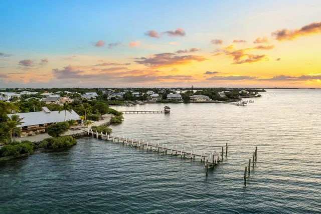 a view of a swimming pool with outdoor seating