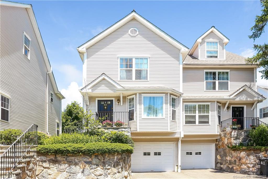 30 Rock Spring Road, Unit C1 Stamford, CT 06906 - Photo 1 of 1 a front view of a house with a yard