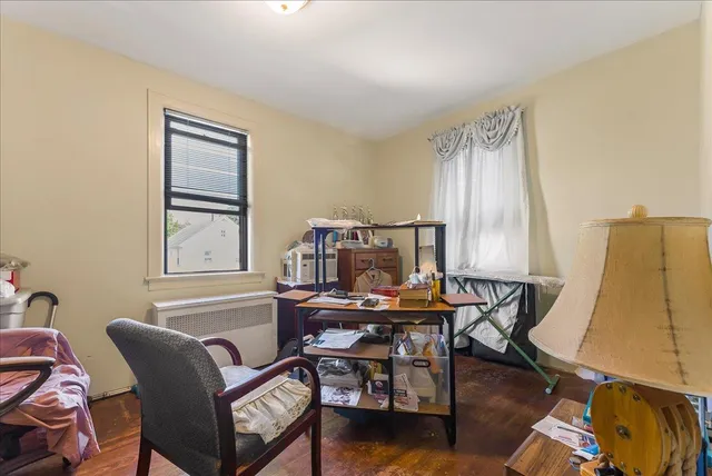 a view of a workspace with furniture and a couch
