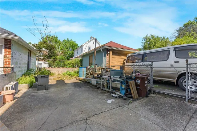 a view of a car park in front of house