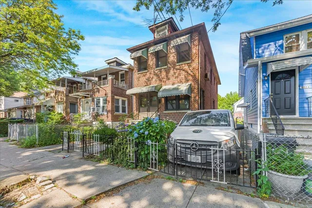 a view of a brick building with many windows