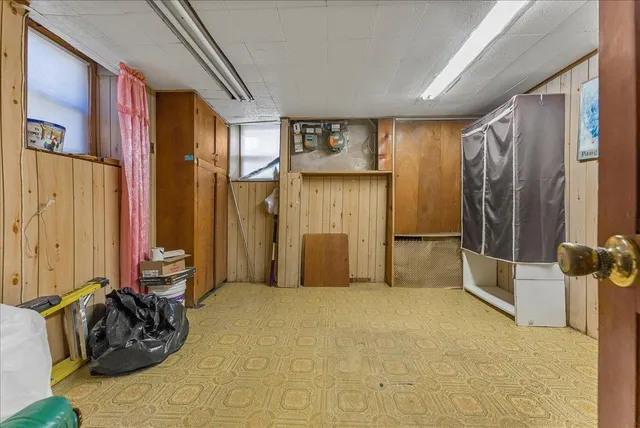 a bed room with a bed and a dresser