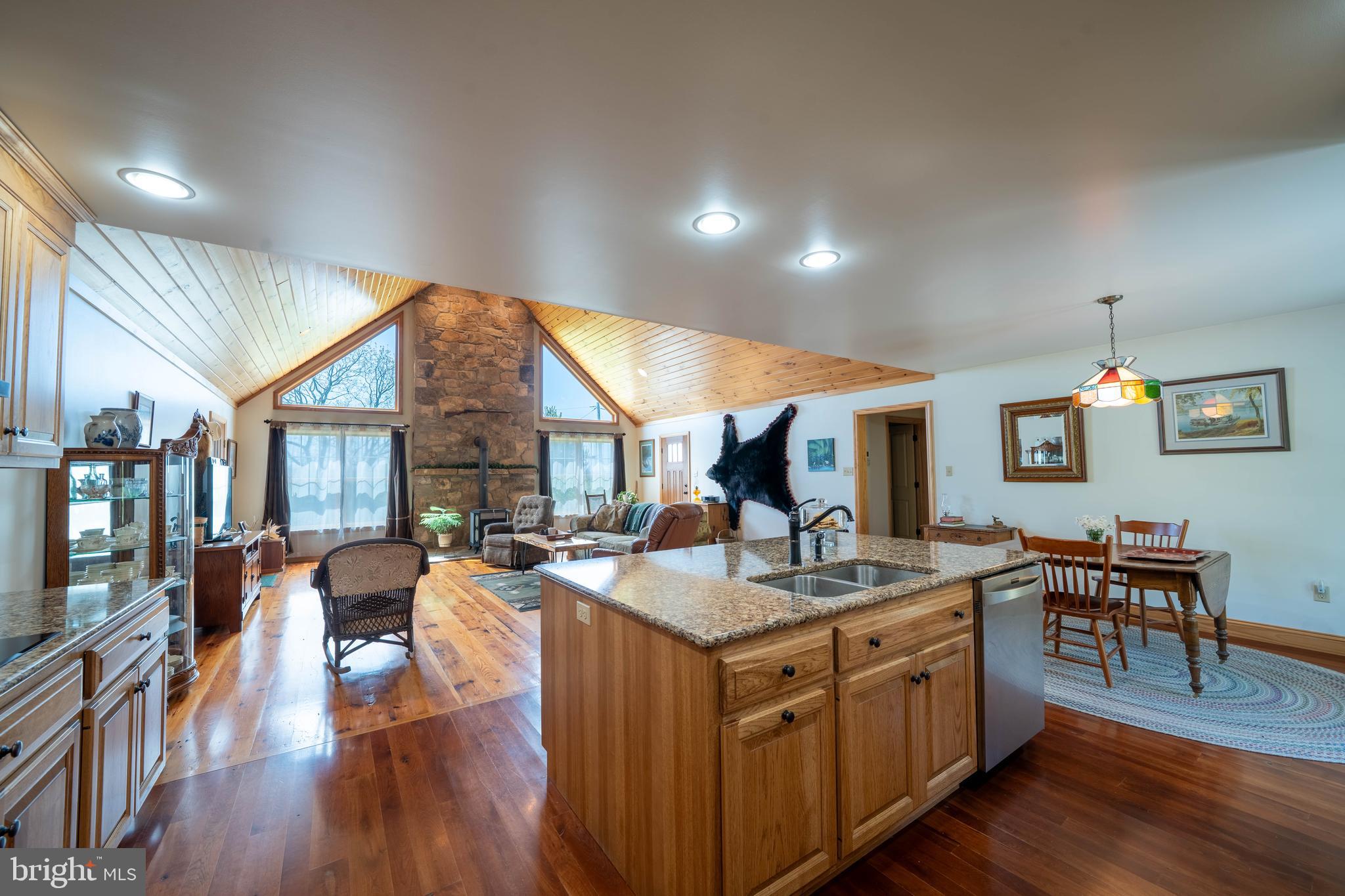 1020 Clark Hill Road Mount Pleasant Mills, PA 17853 - Photo 50 of 76 a living room with stainless steel appliances granite countertop furniture wooden floor and a kitchen view