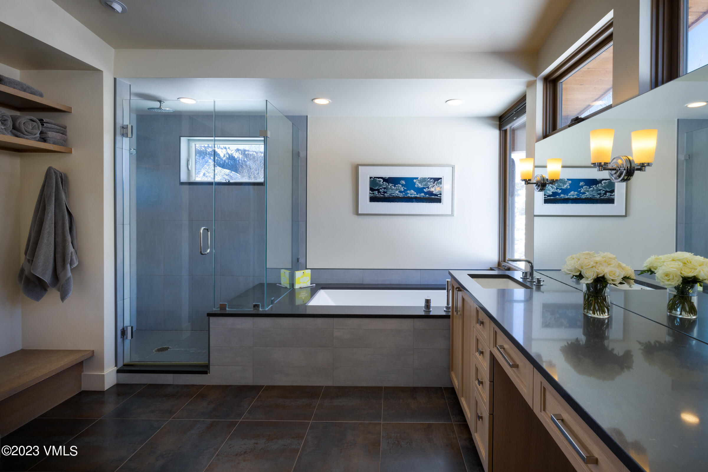 1793 Beard Creek Trail Edwards, CO 81632 - Photo 16 of 28 a bathroom with a tub a sink and mirror