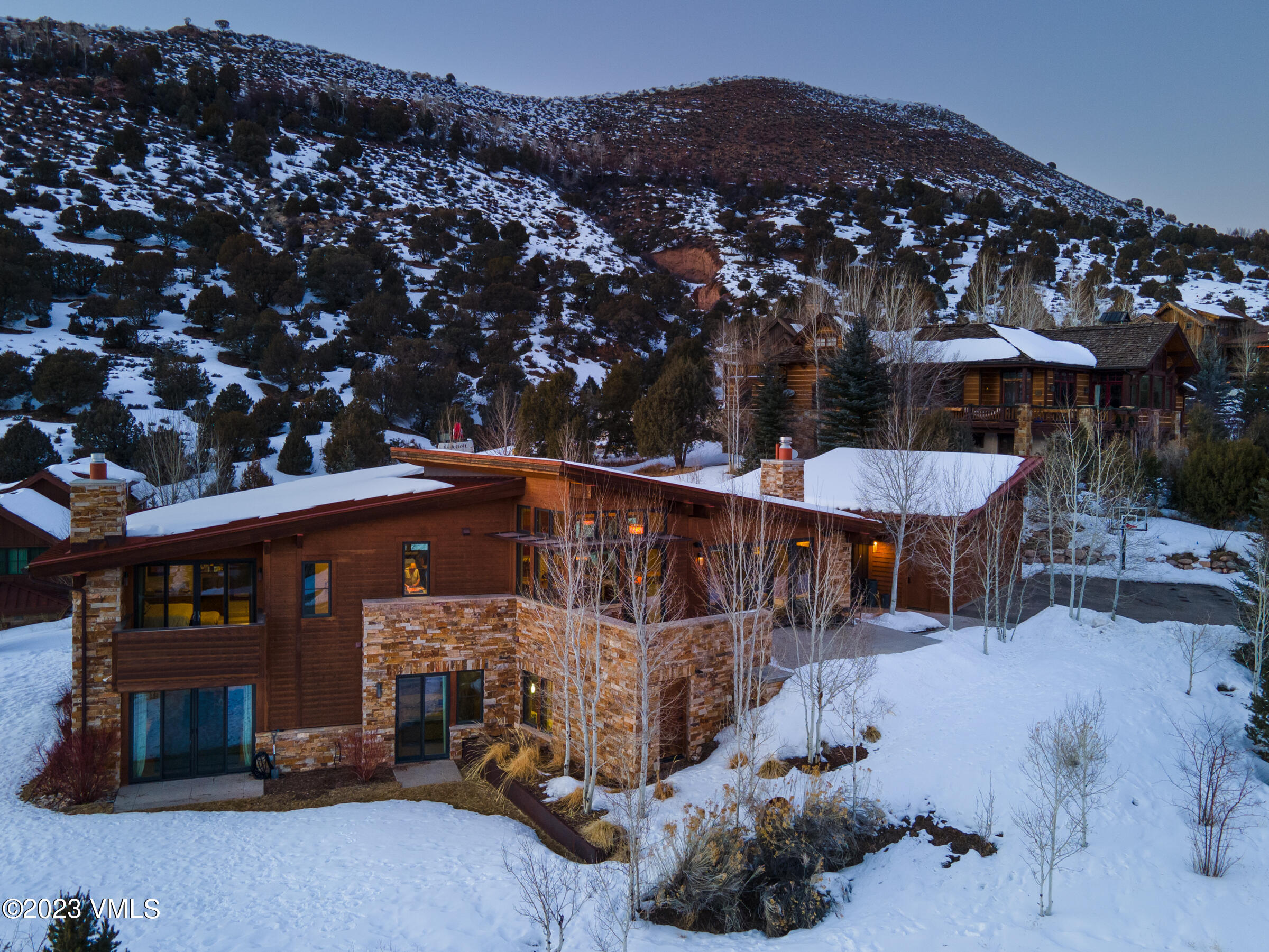 1793 Beard Creek Trail Edwards, CO 81632 - Photo 2 of 28 a view of a patio with a table and chairs under an umbrella