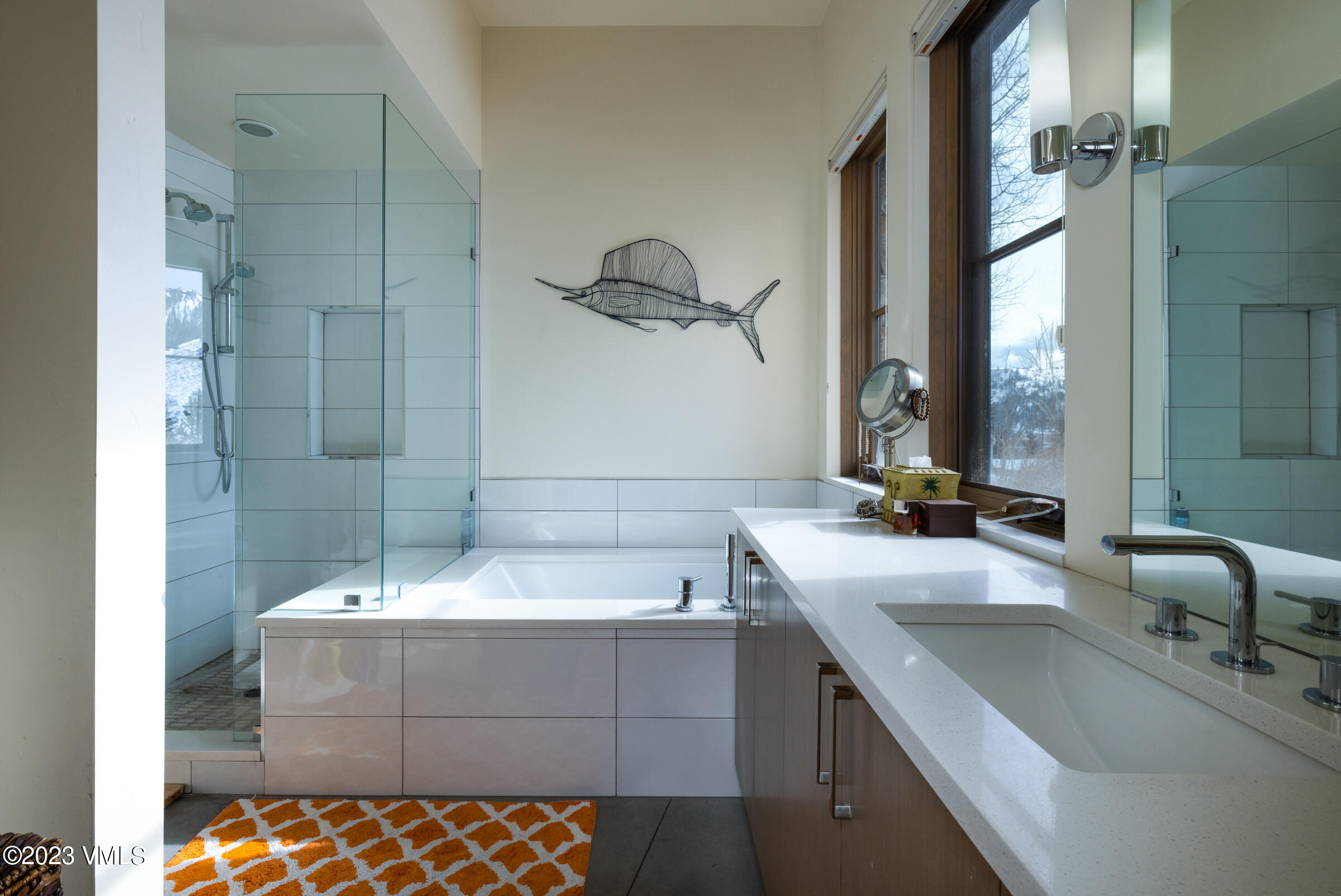 1793 Beard Creek Trail Edwards, CO 81632 - Photo 21 of 28 a bathroom with a bathtub sink and mirror