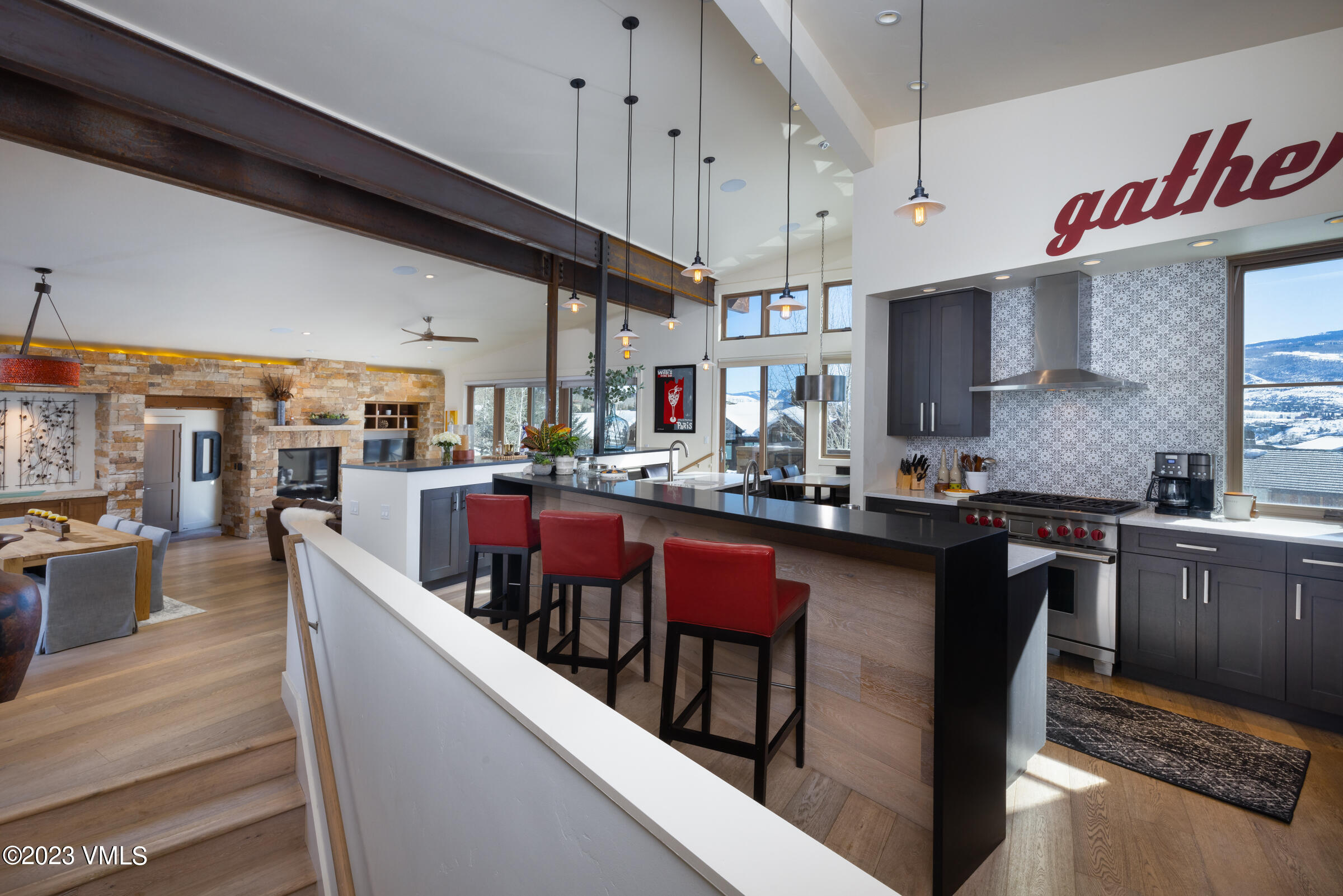 1793 Beard Creek Trail Edwards, CO 81632 - Photo 5 of 28 a kitchen with stainless steel appliances granite countertop a sink a stove and a wooden floors