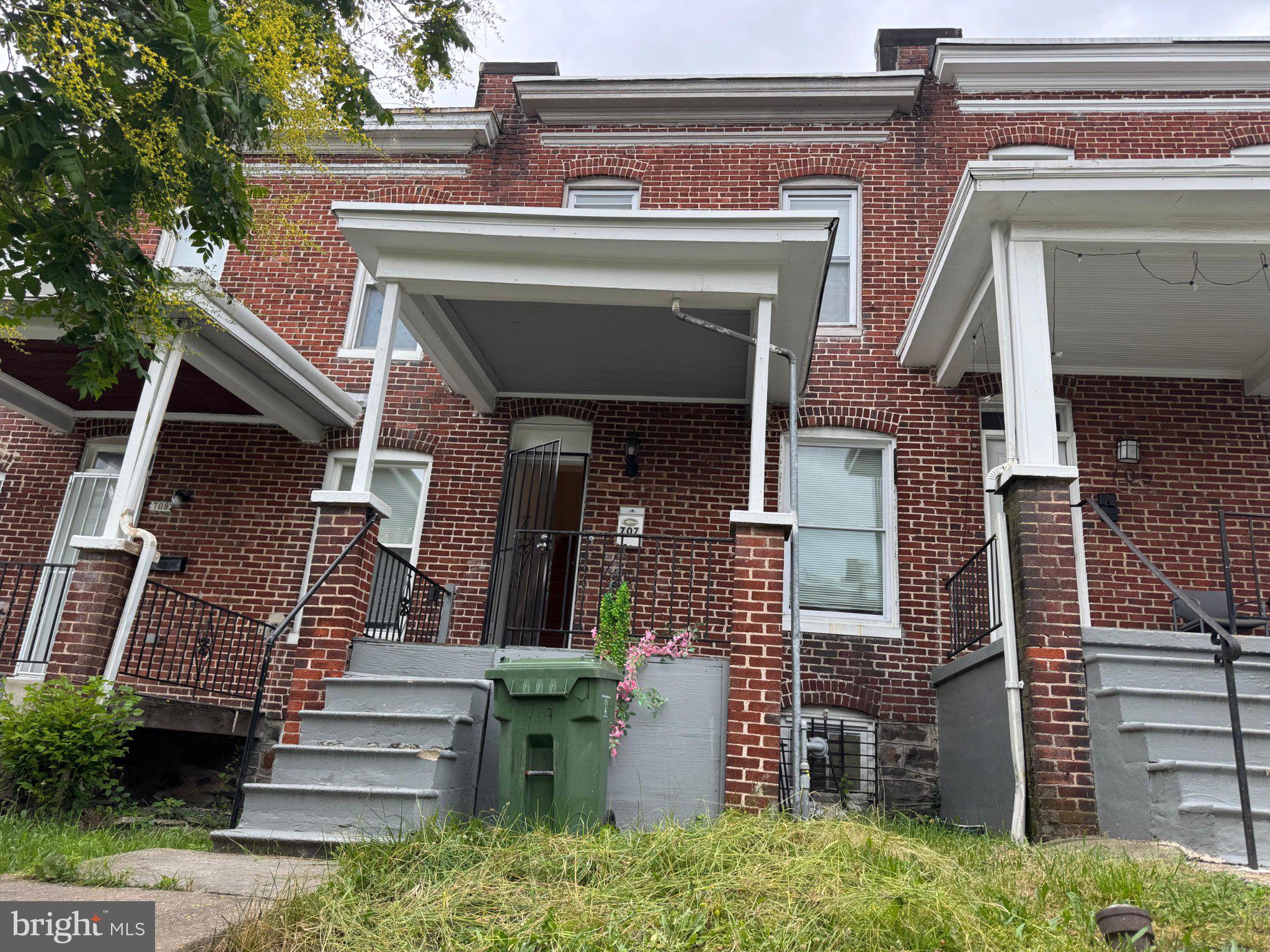 707 Denison Street Baltimore, MD 21229 - Photo 1 of 18 Charming brick facade with inviting porches.