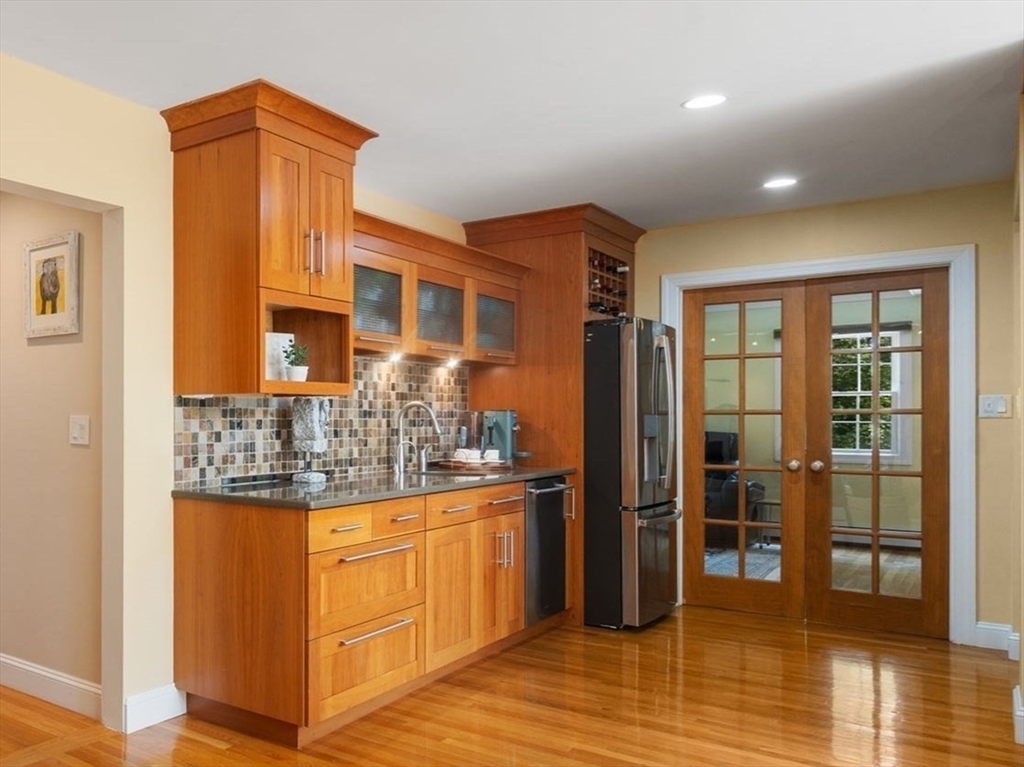 24 Russett Hill Road Sherborn, MA 01770 - Photo 10 of 39 a kitchen with stainless steel appliances granite countertop a refrigerator and stove