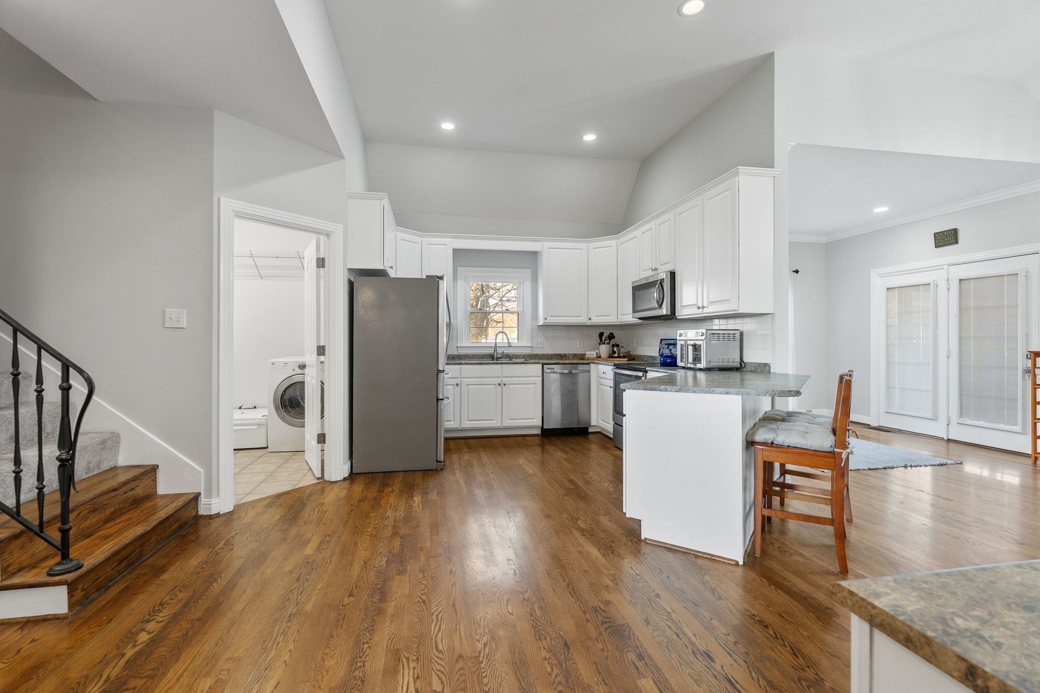2402 Verona Place Murfreesboro, TN 37130 - Photo 12 of 41 a kitchen with stainless steel appliances granite countertop a refrigerator a stove top oven and a wooden floor
