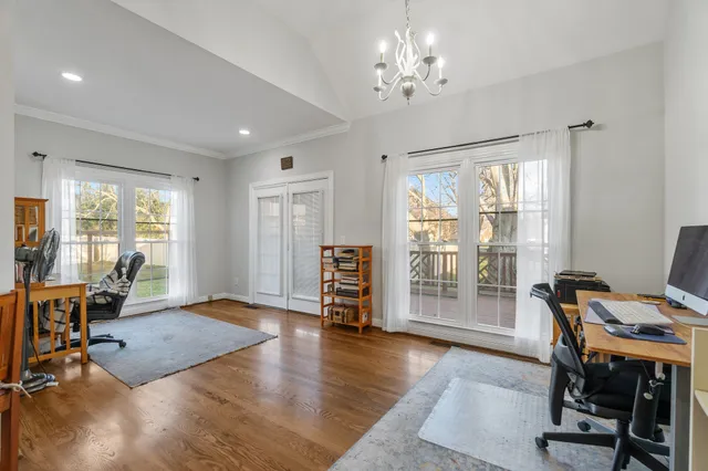 a view of a livingroom with furniture window and wooden floor