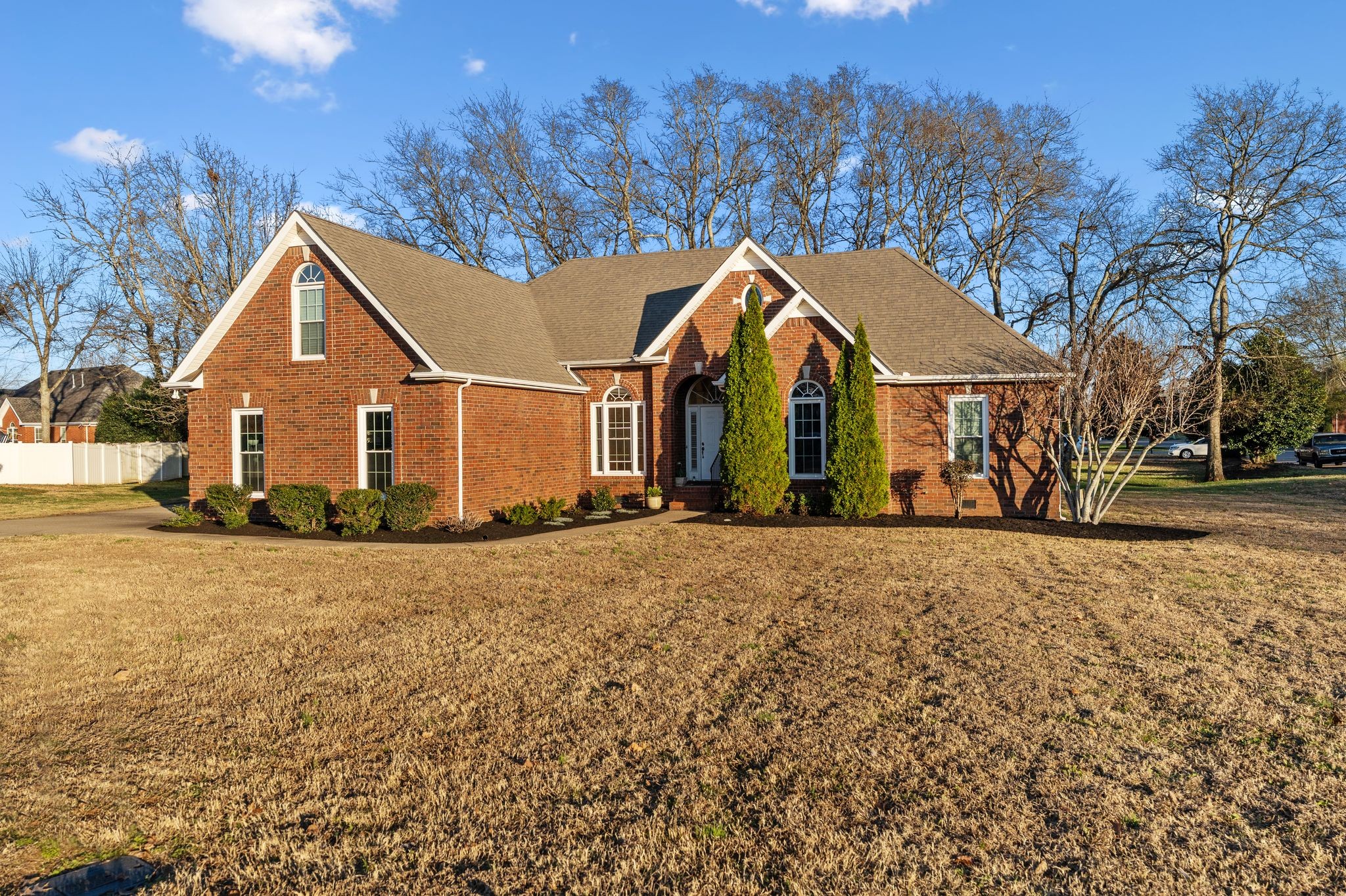 2402 Verona Place Murfreesboro, TN 37130 - Photo 2 of 41 a view of a large house with a yard and large trees