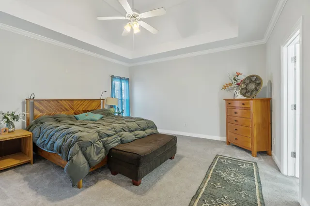 a bedroom with a bed and dresser