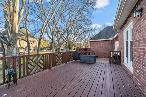 a view of house with deck and outdoor seating