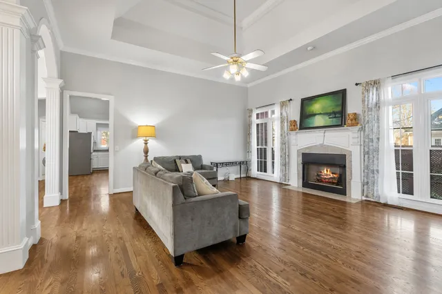 a living room with furniture and a fireplace