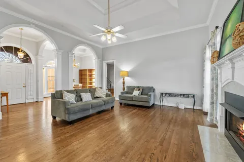 a living room with furniture and a fireplace