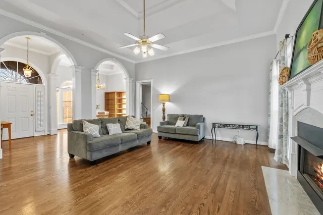 a living room with furniture and a fireplace