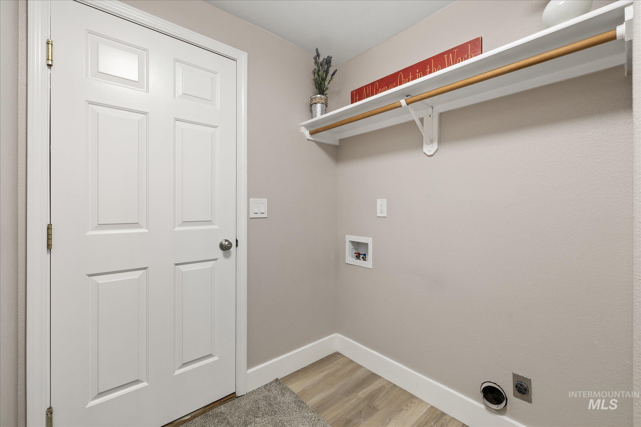 2250 North Amethyst Avenue Meridian, ID 83646 - Photo 43 of 50 Laundry room featuring hookup for a washing machine, light wood-style floors, and electric dryer hookup