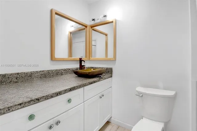 a bedroom with a bed furniture and a book shelf