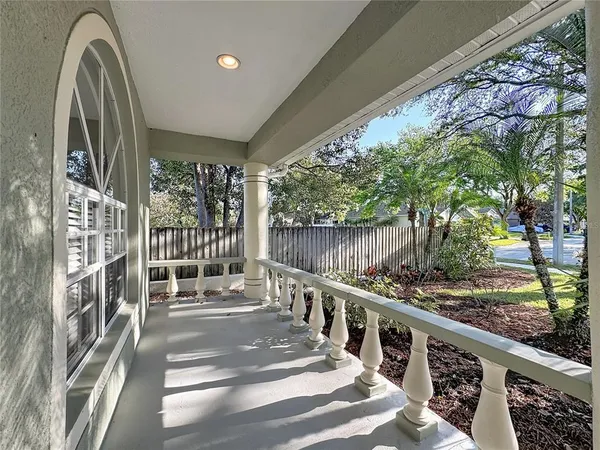 a balcony with wooden floor and outdoor space
