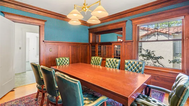 a view of a hallway with a door and stairs