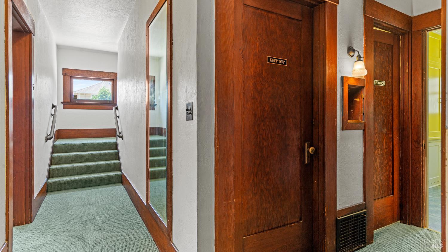 563 Jefferson Street Napa, CA 94559 - Photo 14 of 55 a view of a hallway with a door and stairs