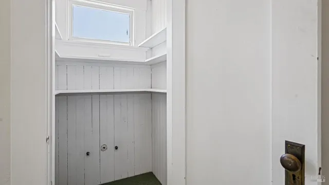 a view of a room with a hallway