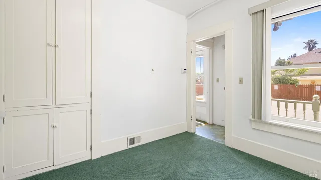 a white toilet sitting next to a bathroom sink