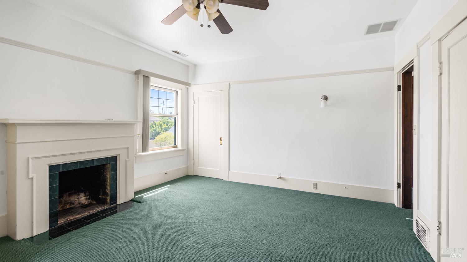 563 Jefferson Street Napa, CA 94559 - Photo 30 of 55 a view of empty room with fireplace and fan