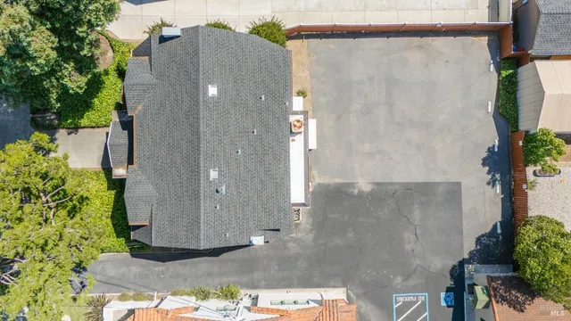 a view of a pathway with a garden