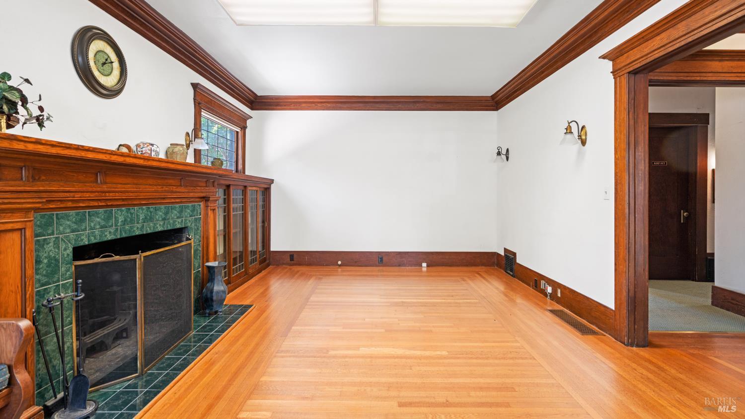563 Jefferson Street Napa, CA 94559 - Photo 8 of 55 a view of an empty room with wooden floor and a fireplace