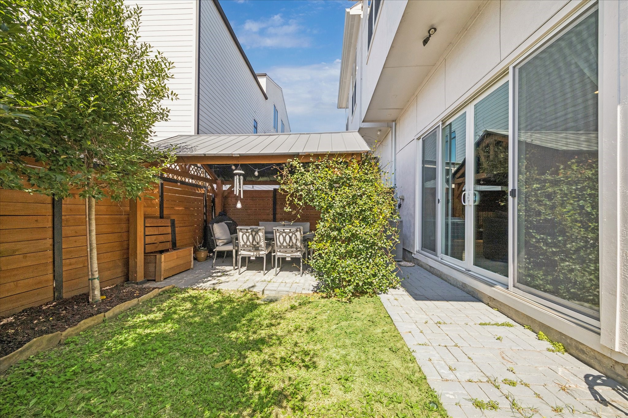 1311 Laird Street Houston, TX 77008 - Photo 13 of 28 Imagine relaxing, entertaining and gardening in this perfectly sized backyard wrapped in handsome horizontal fencing.