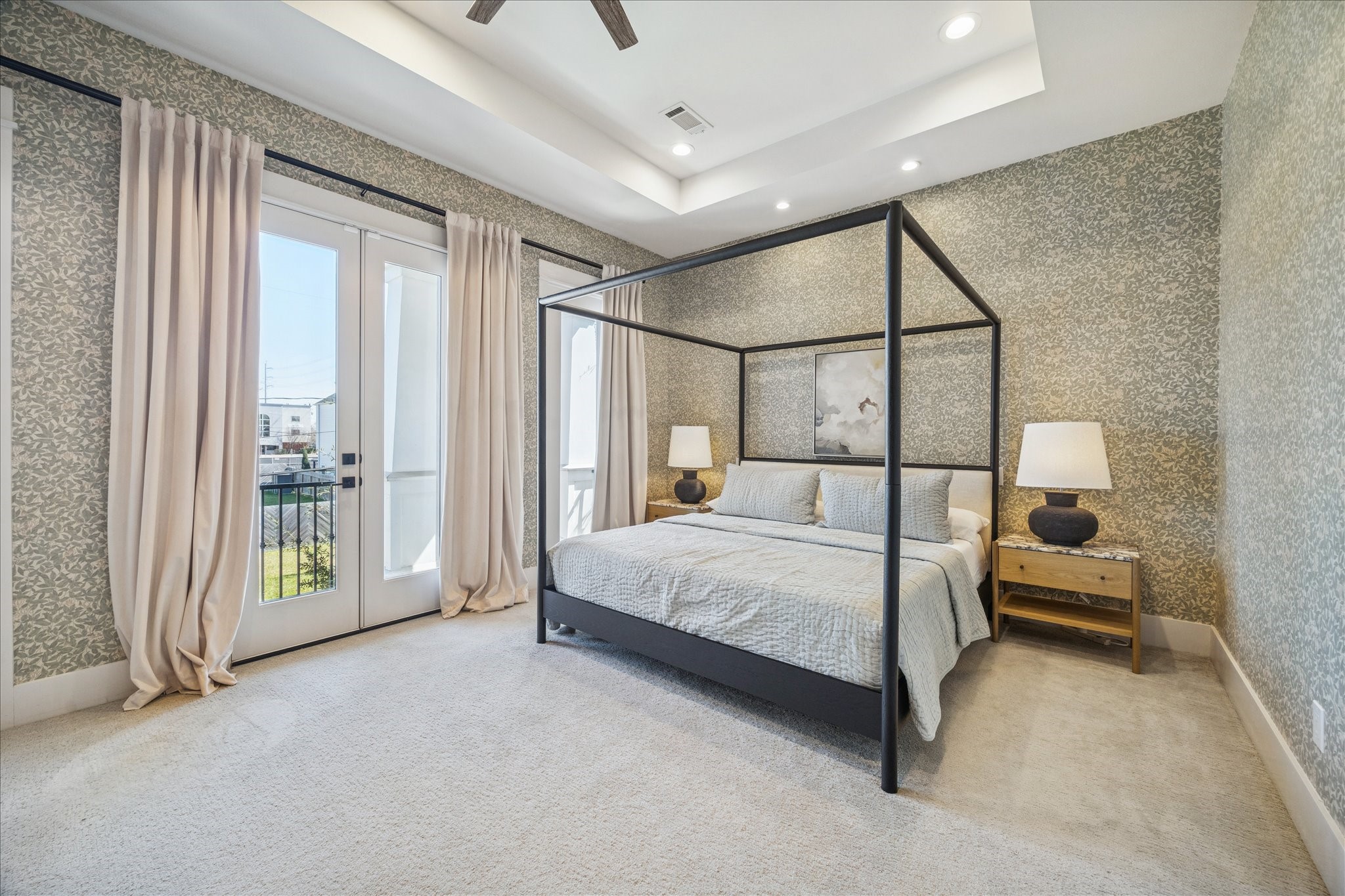 1311 Laird Street Houston, TX 77008 - Photo 21 of 28 A wall of east-facing windows and French doors drenches the primary suite with natural light.