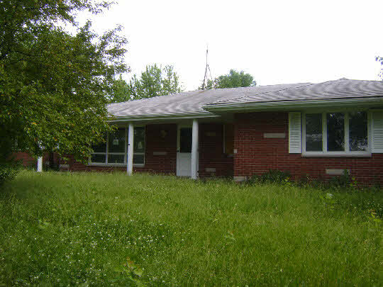 5455 Baxter Road Rockford, IL 61109 - Photo 3 of 11 a view of a house with a backyard