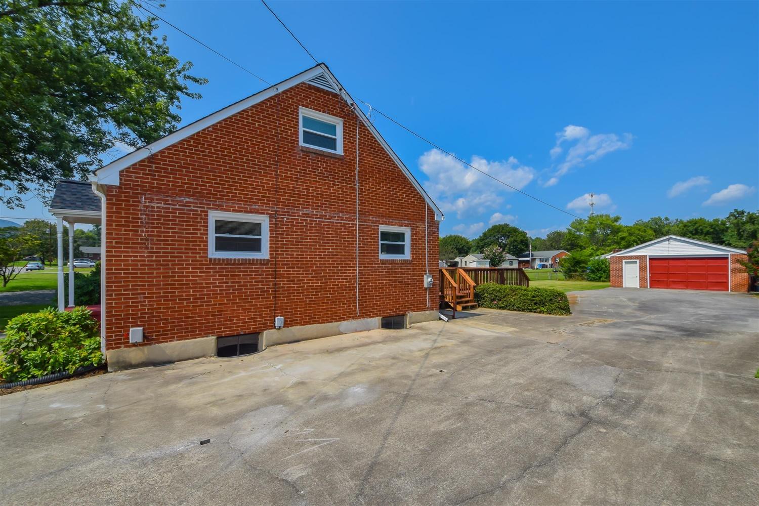 2027 Laura Road Northwest Roanoke, VA 24017 - Photo 18 of 26 a view of a house with a yard