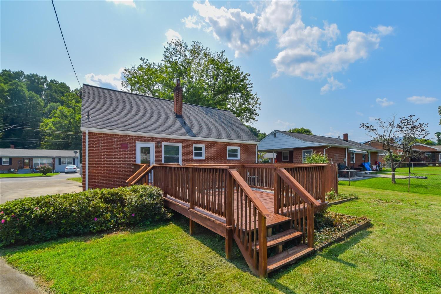2027 Laura Road Northwest Roanoke, VA 24017 - Photo 19 of 26 a view of a house with a yard