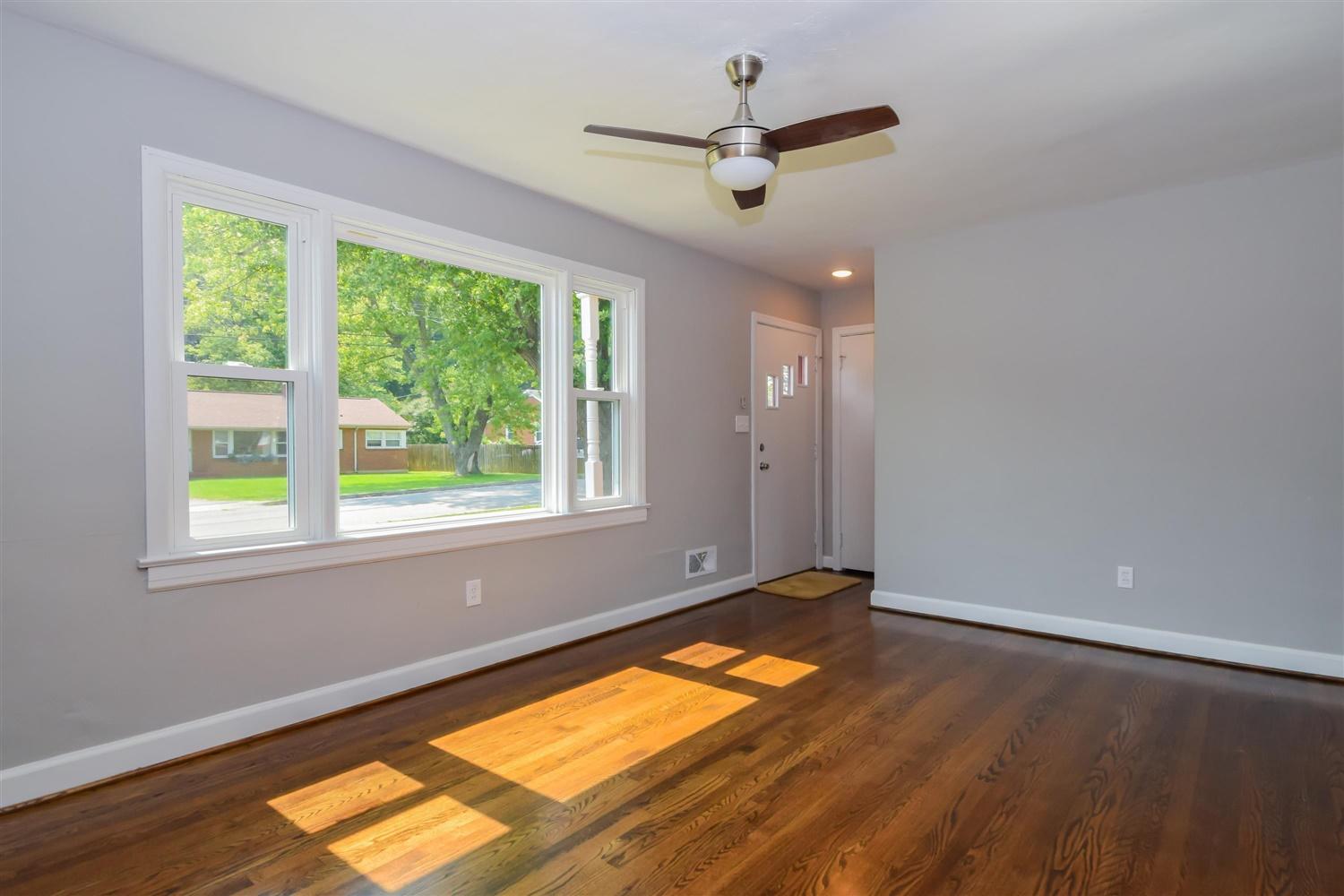 2027 Laura Road Northwest Roanoke, VA 24017 - Photo 5 of 26 a view of empty room with wooden floor and fan