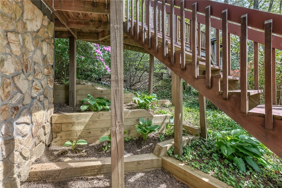 174 Spruce Pine Road Newland, NC 28657 - Photo 35 of 50 a view of a pathway of a house with a fountain balcony