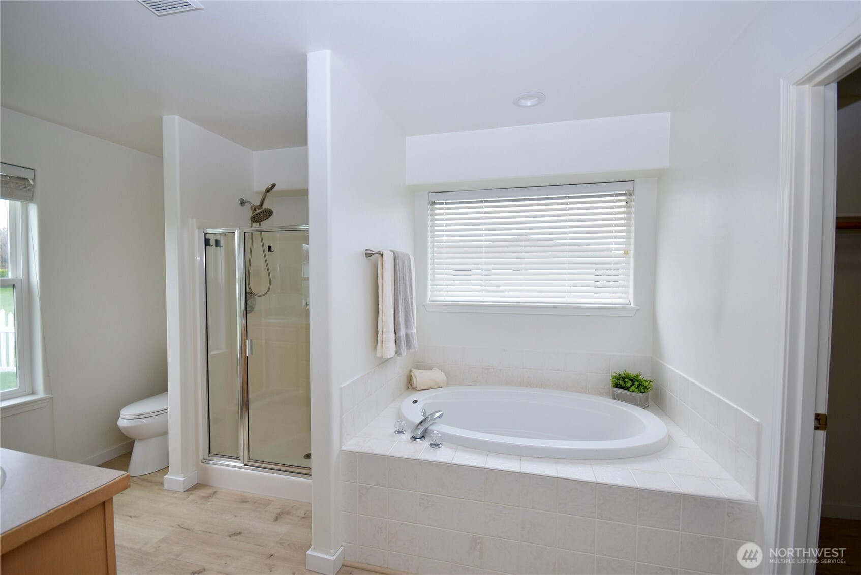 71 John Carl Road Sequim, WA 98382 - Photo 18 of 37 a bath room with a bath tub and a shower