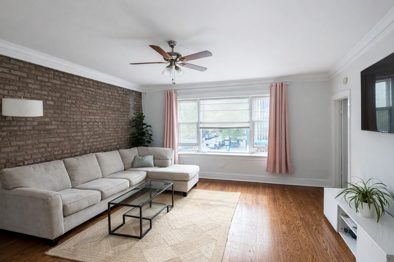 2461 North Clark Street, Unit 2 Chicago, IL 60614 - Photo 3 of 9 a living room with furniture and a large window