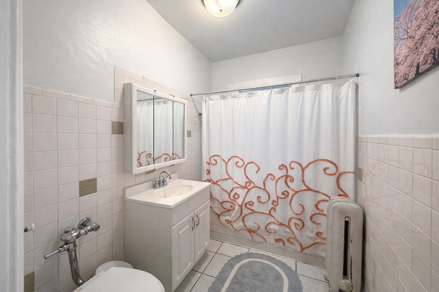2461 North Clark Street, Unit 2 Chicago, IL 60614 - Photo 6 of 9 a bathroom with a sink and mirror with toilet