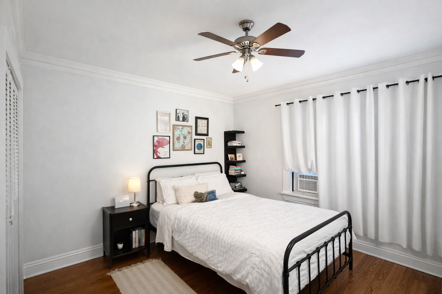 2461 North Clark Street, Unit 2 Chicago, IL 60614 - Photo 8 of 9 a bedroom with a large bed and a chandelier