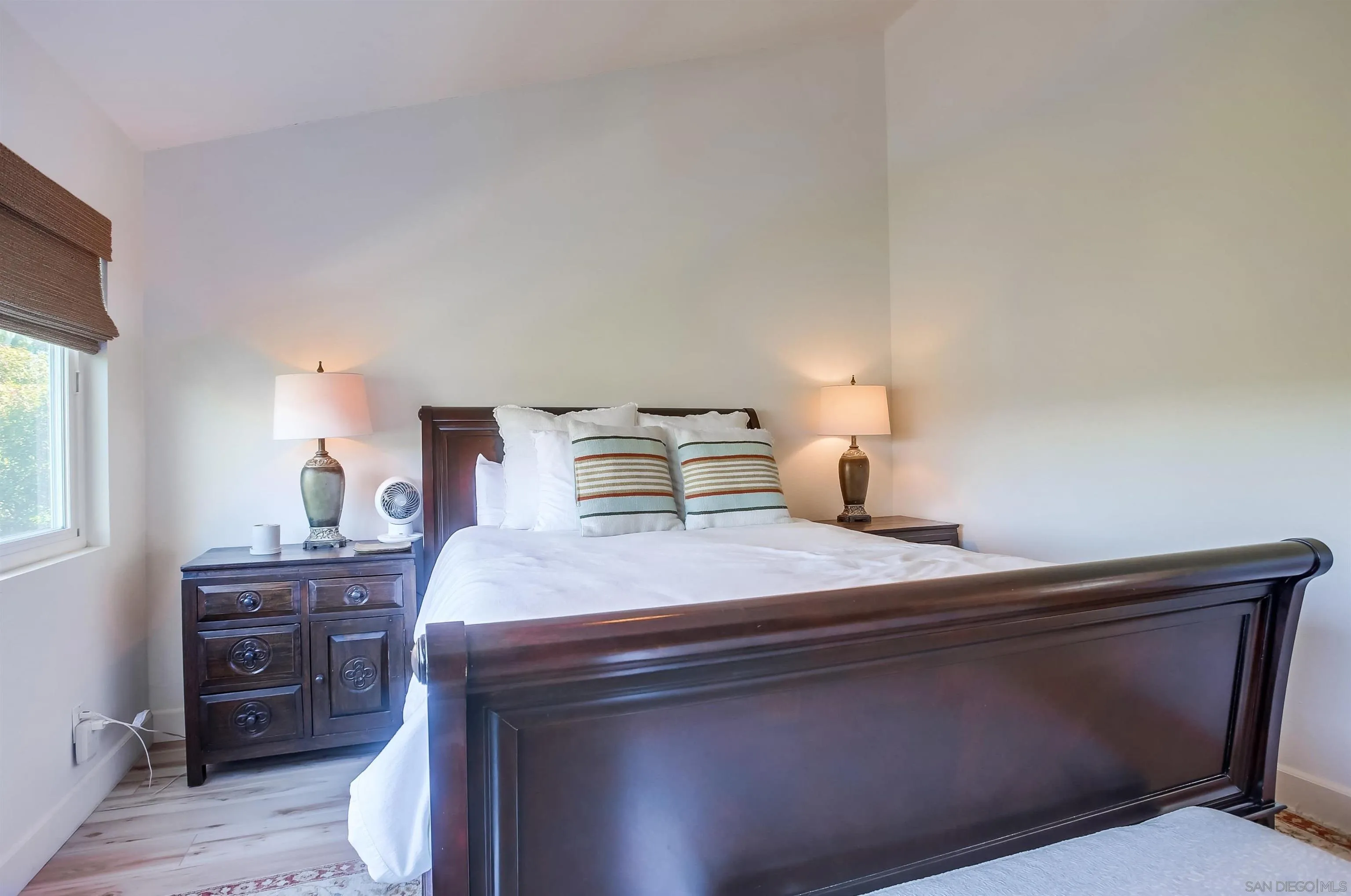 1709 Kennington Road Encinitas, CA 92024 - Photo 12 of 25 a bedroom with a bed and window