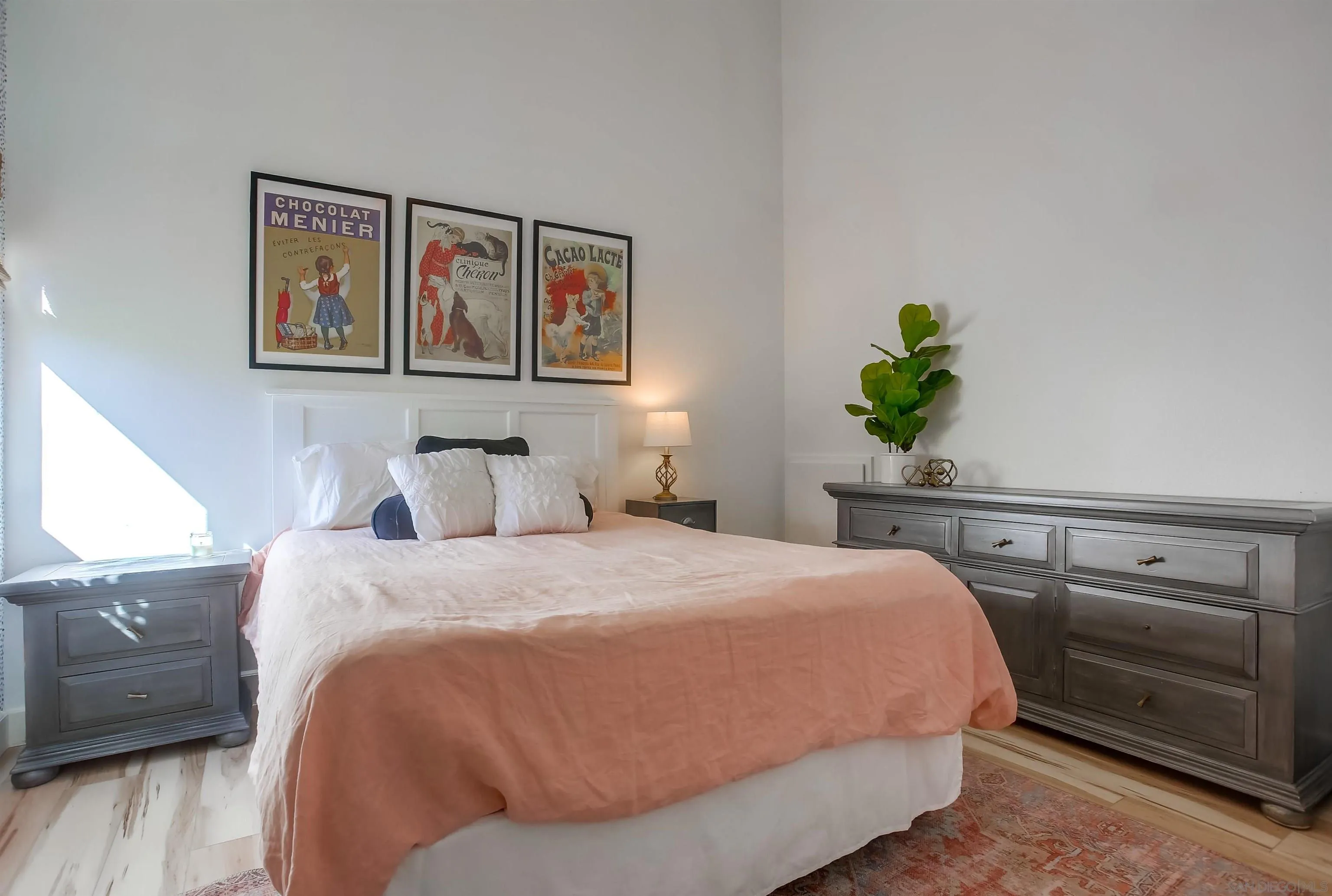 1709 Kennington Road Encinitas, CA 92024 - Photo 15 of 25 a bedroom with a bed and painting on the wall